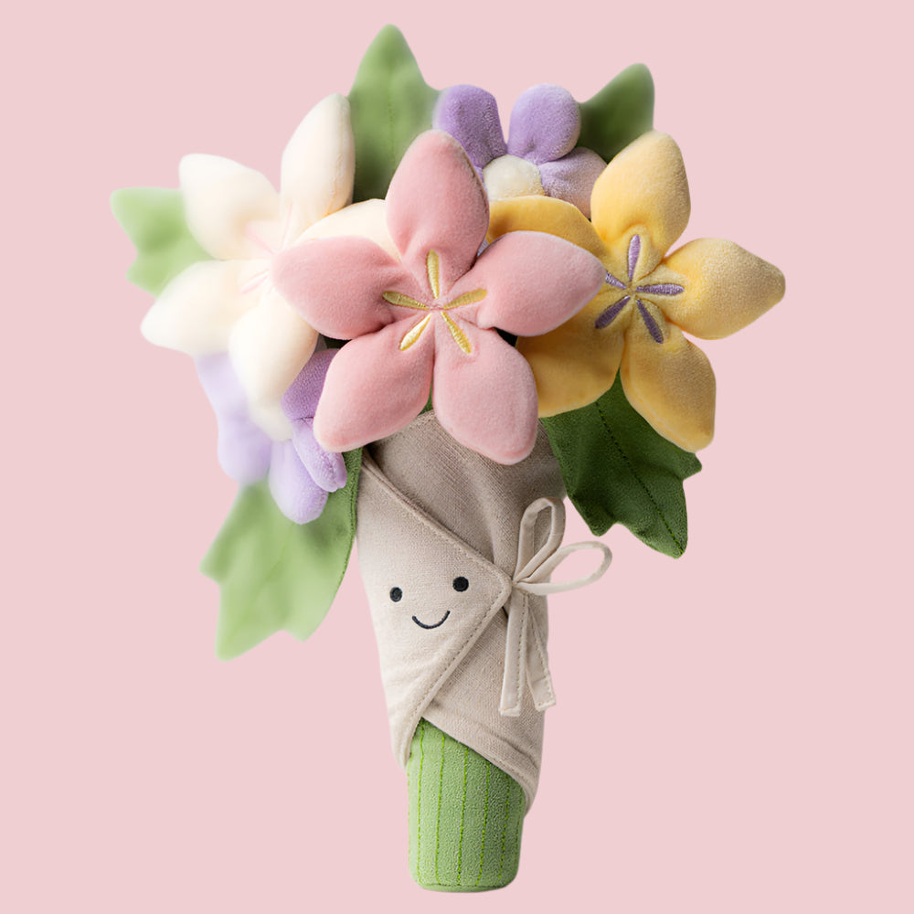 Toy flower bouquet with a smiling face on a white background